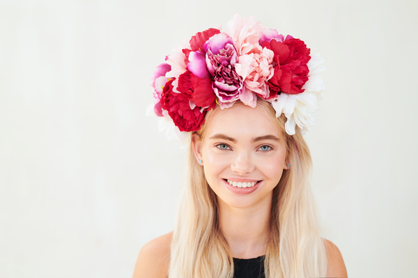 Woman with Wreath of Peonies Smiles